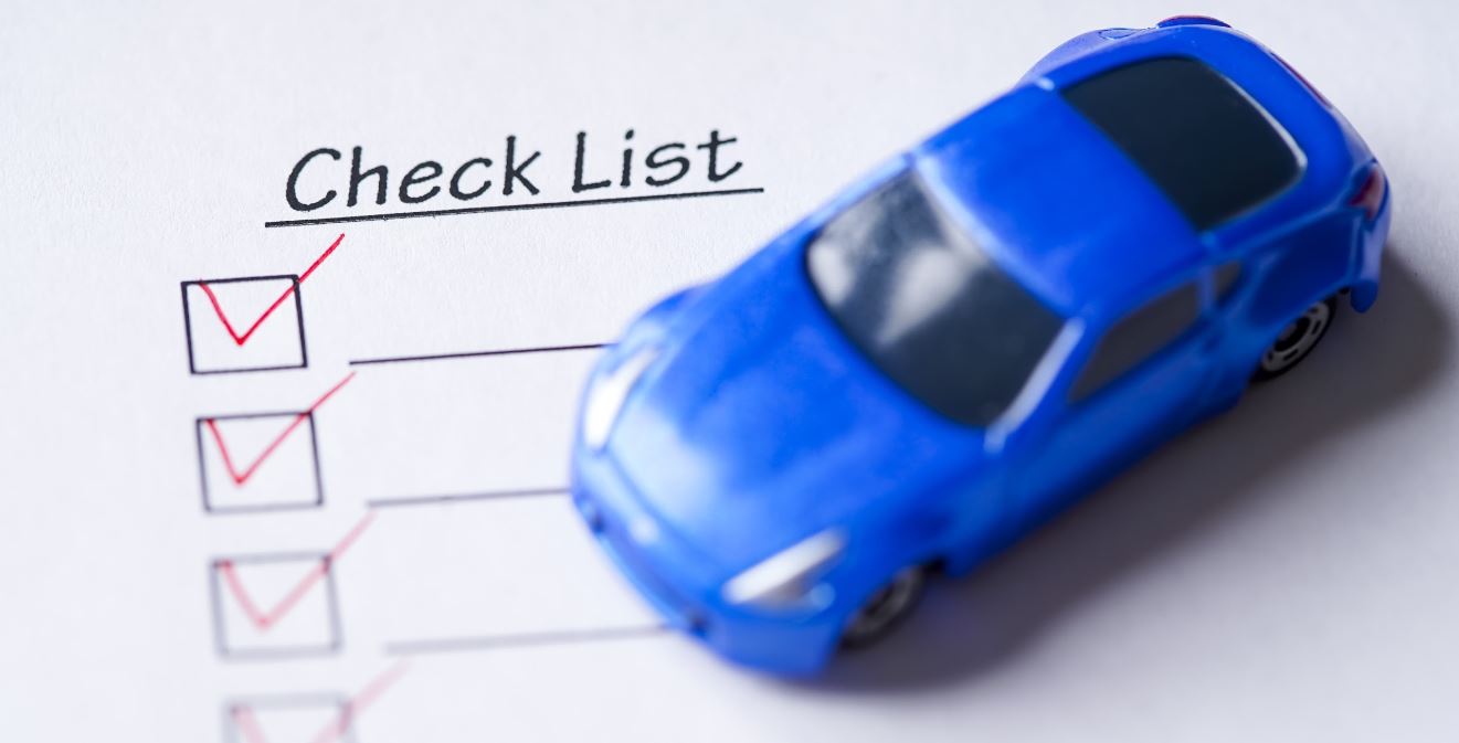 Blue toy car and checklist