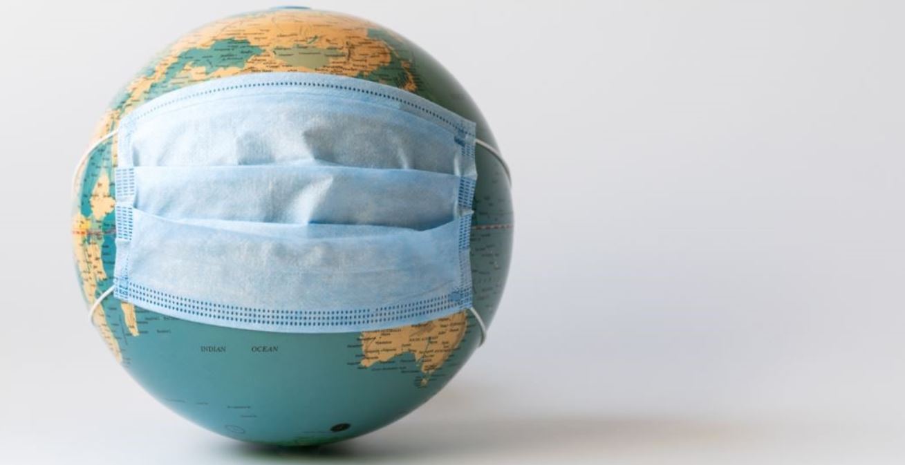 Globe wearing a facemask